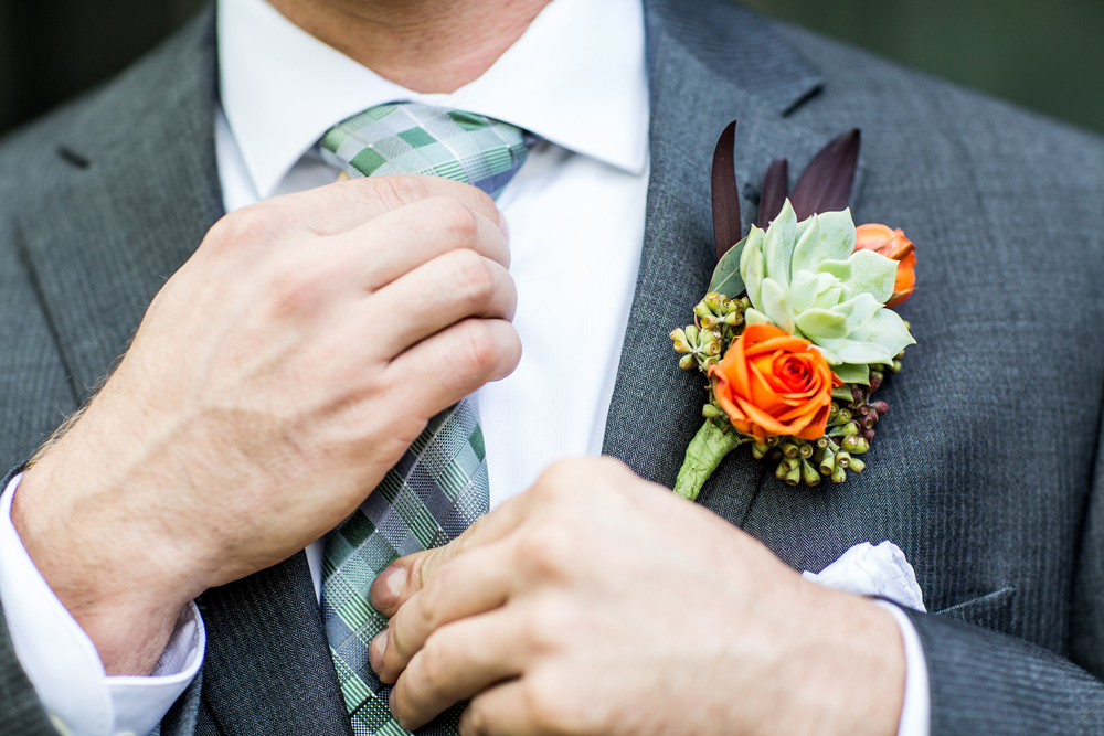 Why would a man wear a corsage or a boutonniere flower
