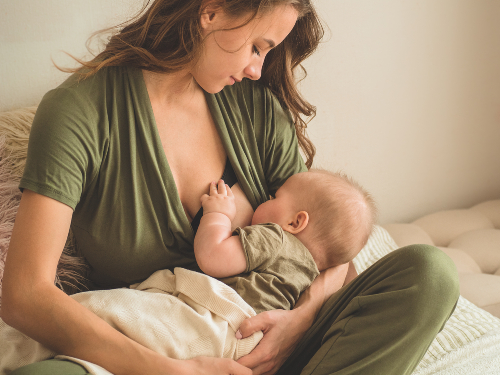 How do women with extremely large breasts breastfeed